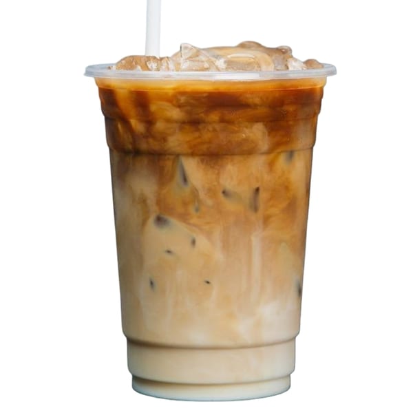 Iced coffee with milk and ice in a clear plastic cup with a straw.