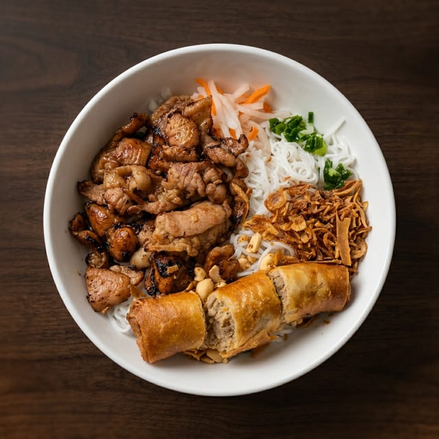 B5- Vermicelli with Grilled Pork & Egg Rolls (2 Pieces).